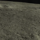 A panoramic view showing the rock (just to the right of center and along the edge of the crater).